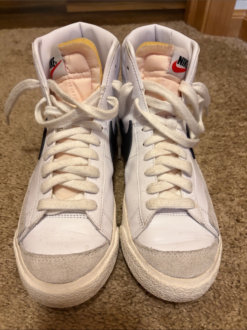 Nike White High-Top Sneakers with Black Swoosh and Pink Tongue